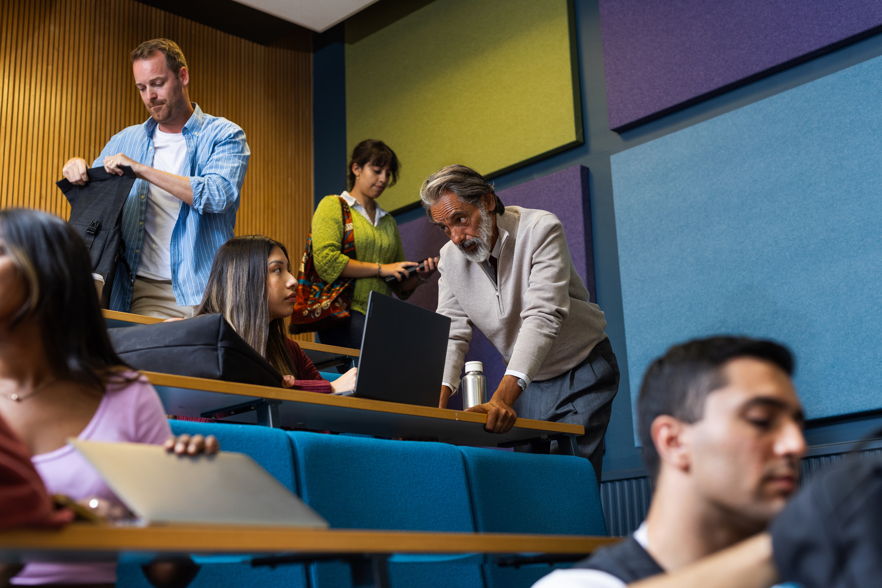 A group of students and the chairperson prepare for the roundtable.