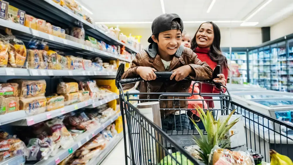 Happy family grocery shopping.
