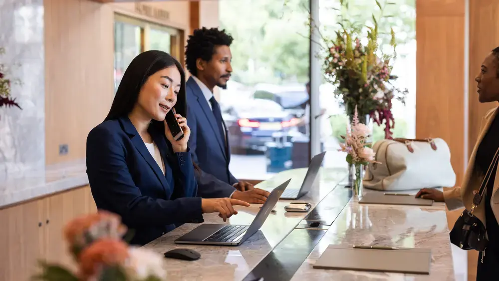 Hotel receptionists at work.