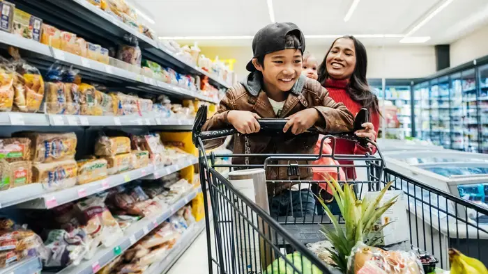 Happy family grocery shopping.
