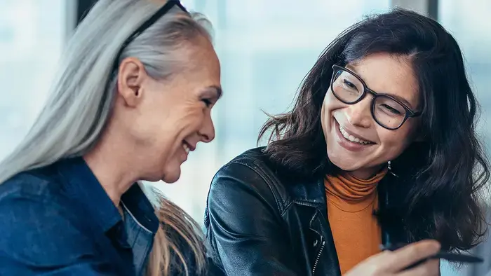 Two payroll professionals