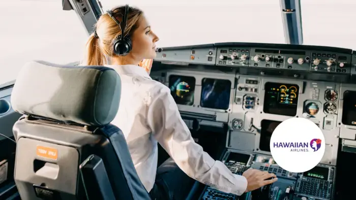Female pilot in airplane cockpit.