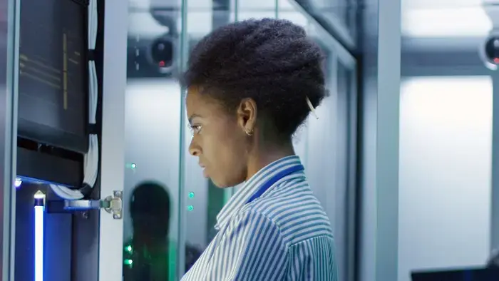 An engineer works on the on-site server in a data center.