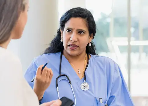 Doctor and patient discussing healthcare.